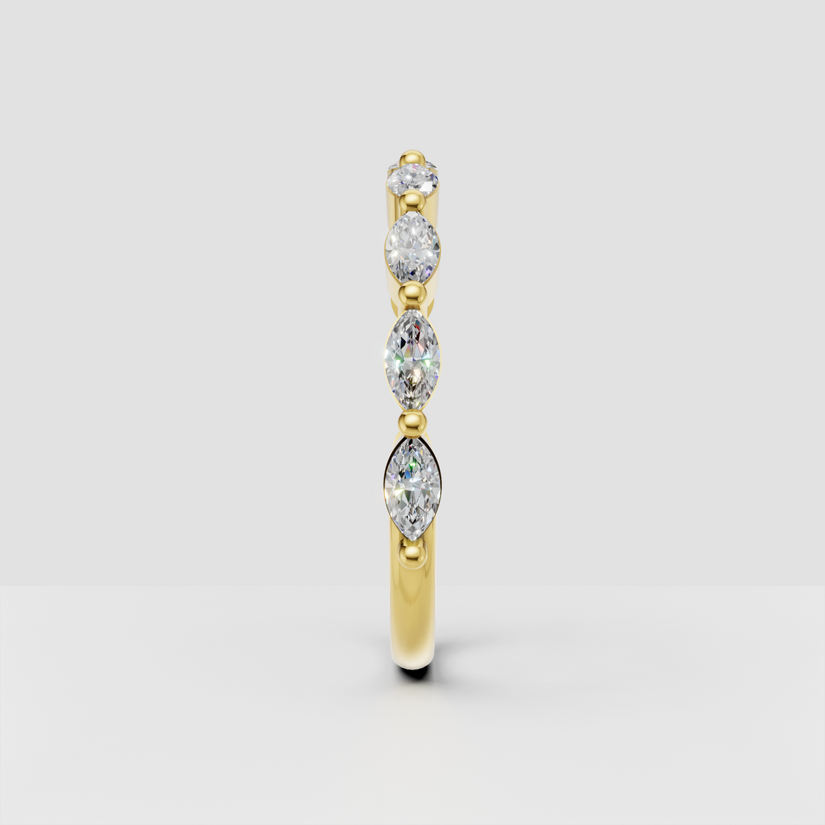 Yellow gold eternity ring featuring marquise and round diamonds