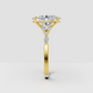 Yellow gold oval diamond engagement ring with four prongs