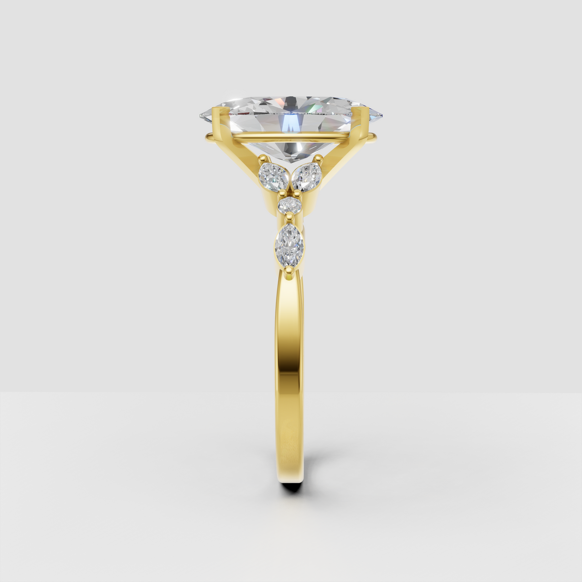 Yellow gold oval diamond engagement ring with four prongs