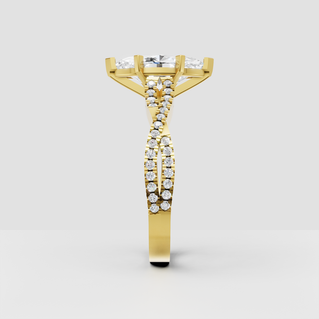 Marquise cut diamond ring with elongated center stone, six prongs, and split shank pavé band.