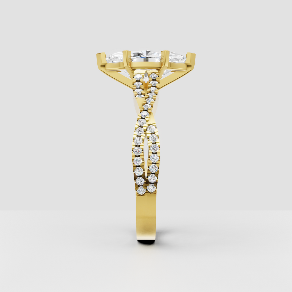 Marquise cut diamond ring with elongated center stone, six prongs, and split shank pavé band.
