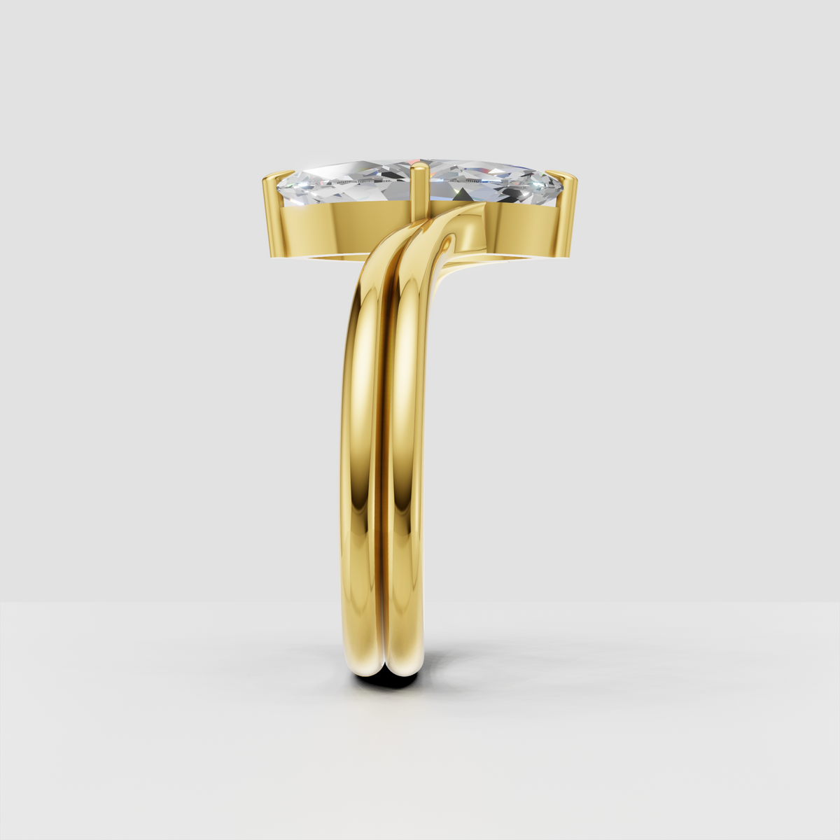 Yellow gold marquise solitaire ring with sculpted prongs