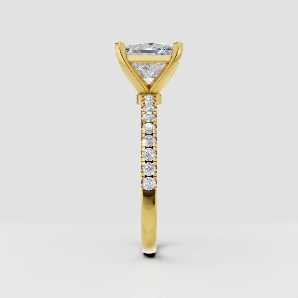 Yellow gold princess cut diamond solitaire with shoulder accent stones