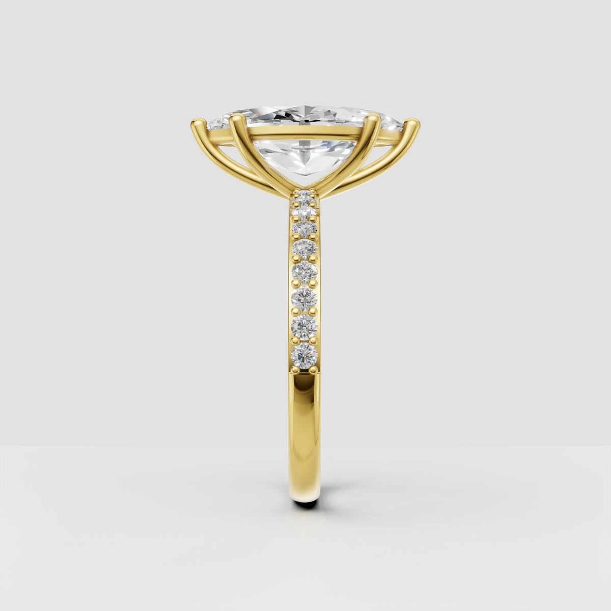 Yellow gold marquise cut diamond ring with cathedral-style shoulders