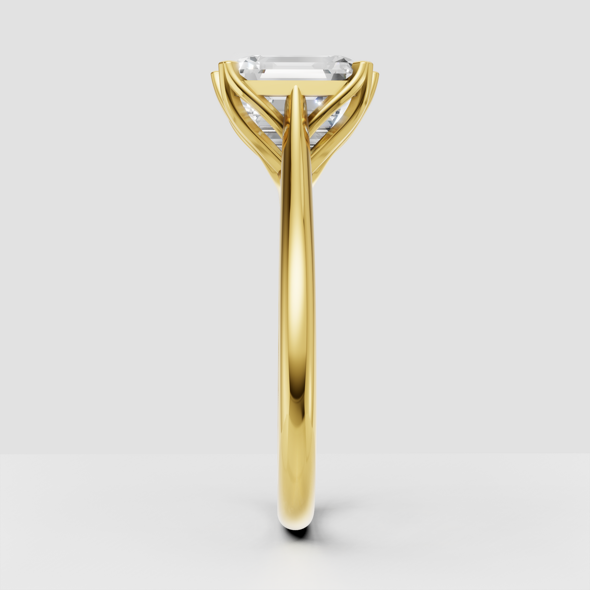 Yellow gold emerald cut diamond ring with elegant prong setting