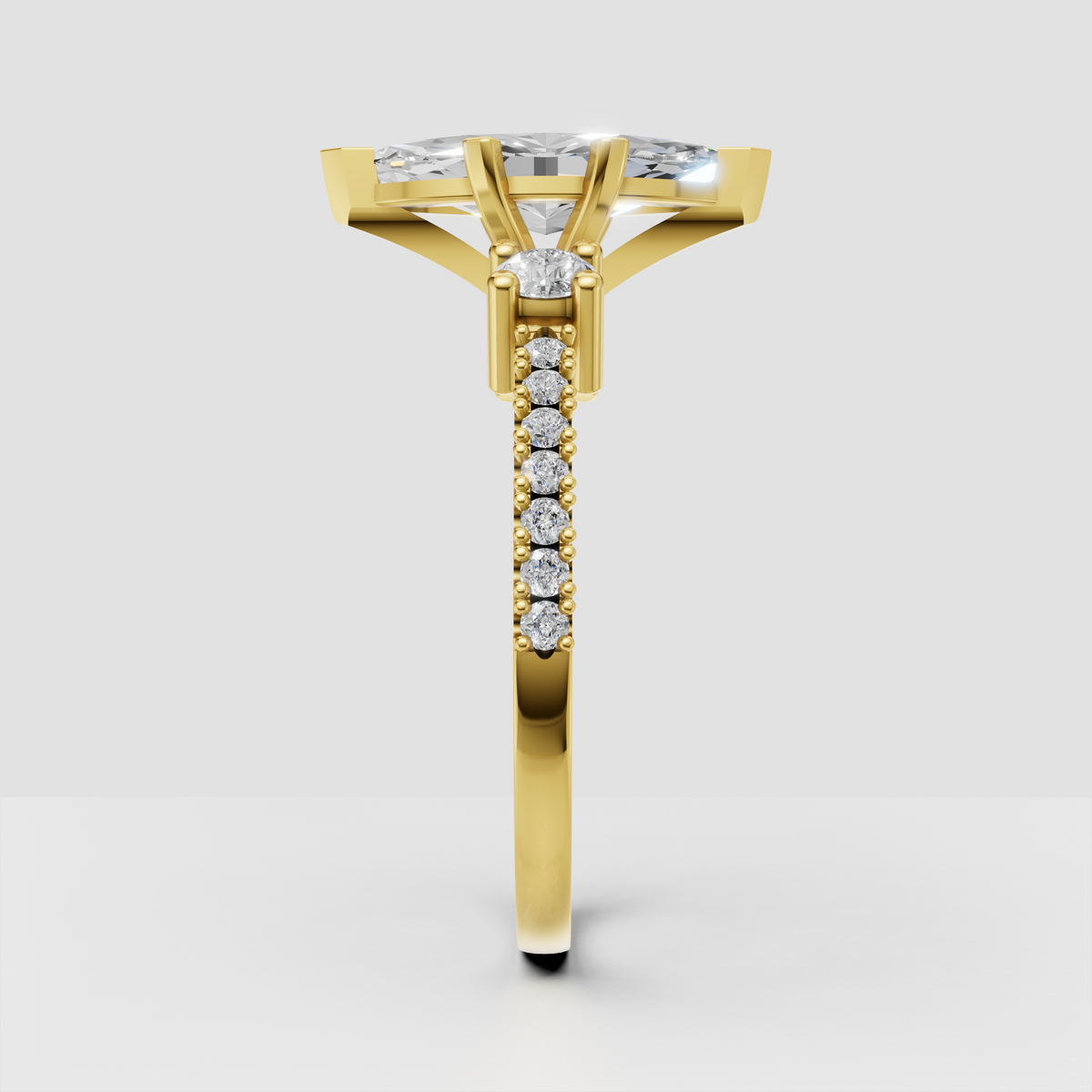Marquise cut engagement ring featuring a polished yellow gold band
