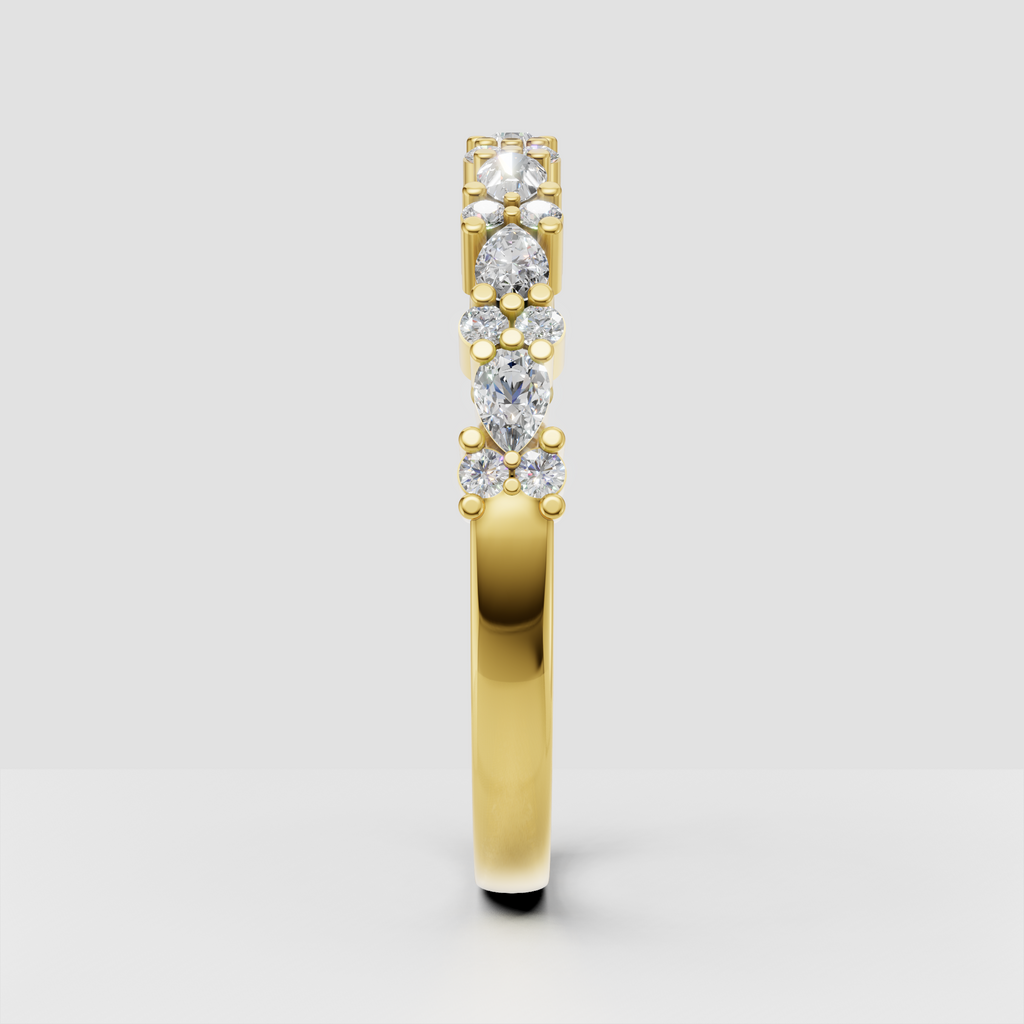 Yellow gold pear and round diamond ring