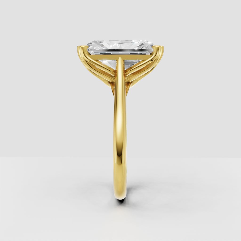 Rectangular radiant diamond ring with elegant yellow gold prong setting