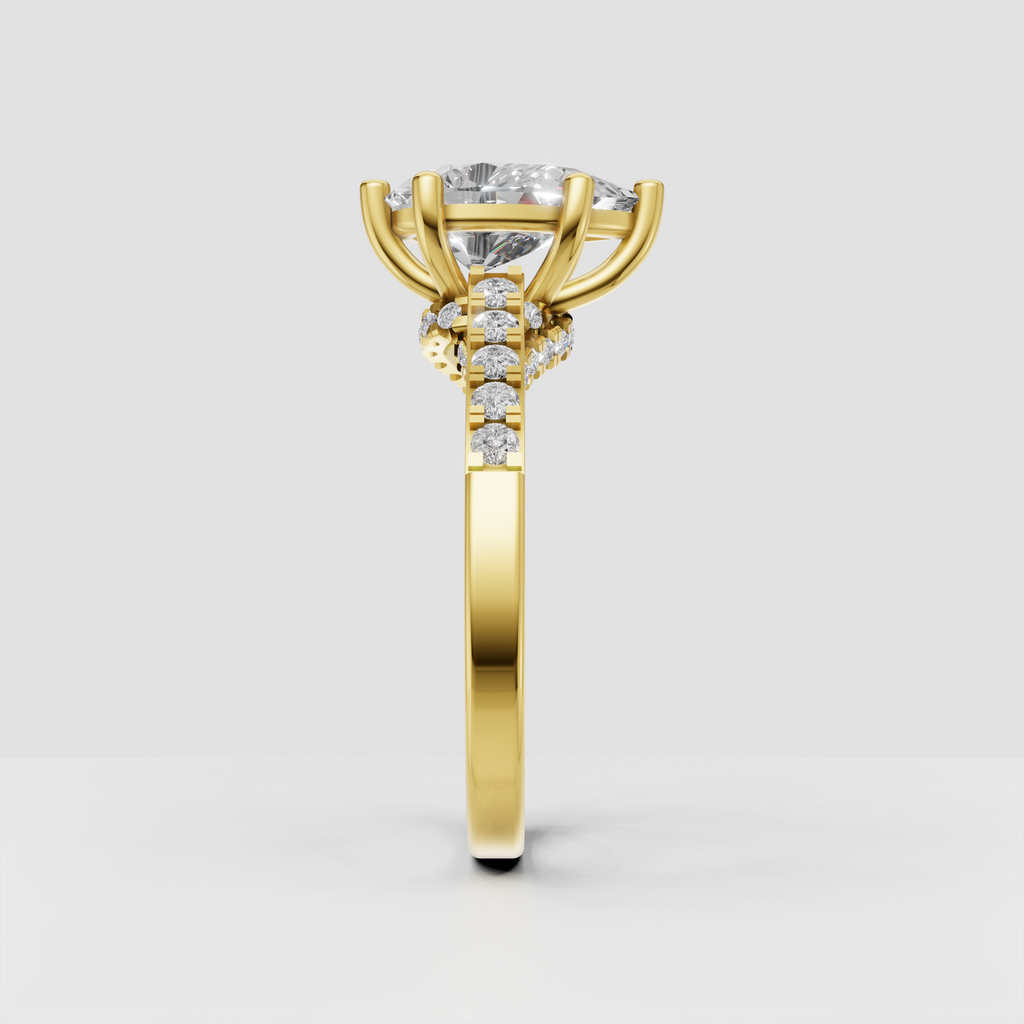Elegant pear cut engagement ring with split shank and round diamond shoulder accents