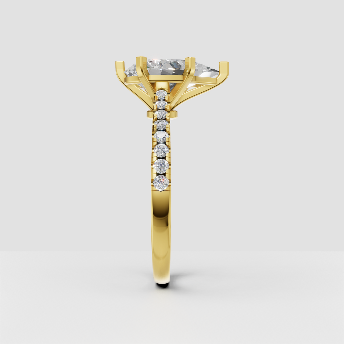 Yellow gold pear-shaped diamond ring with pavé-set accent stones