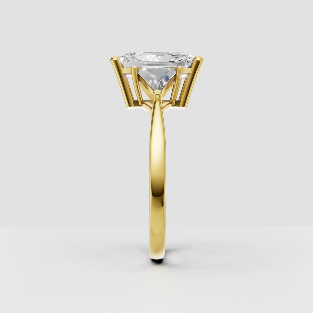 Yellow gold radiant diamond engagement ring with three-stone prong setting