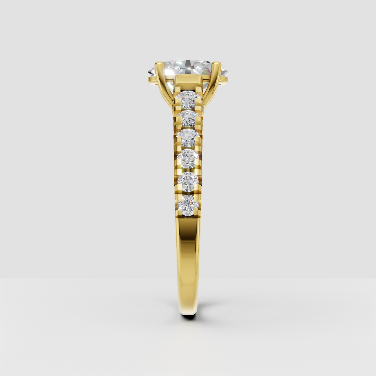 Yellow gold oval solitaire ring with sparkling accent diamonds