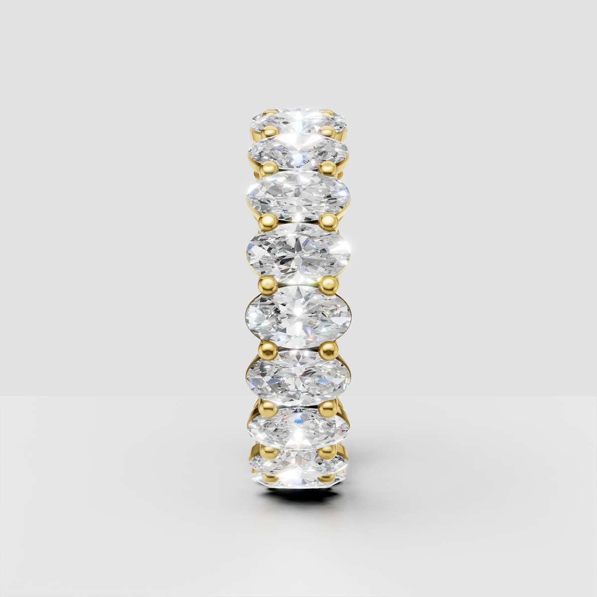 Full oval diamond eternity ring with shared prong setting