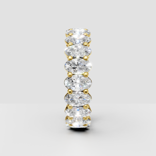 Full oval diamond eternity ring with shared prong setting