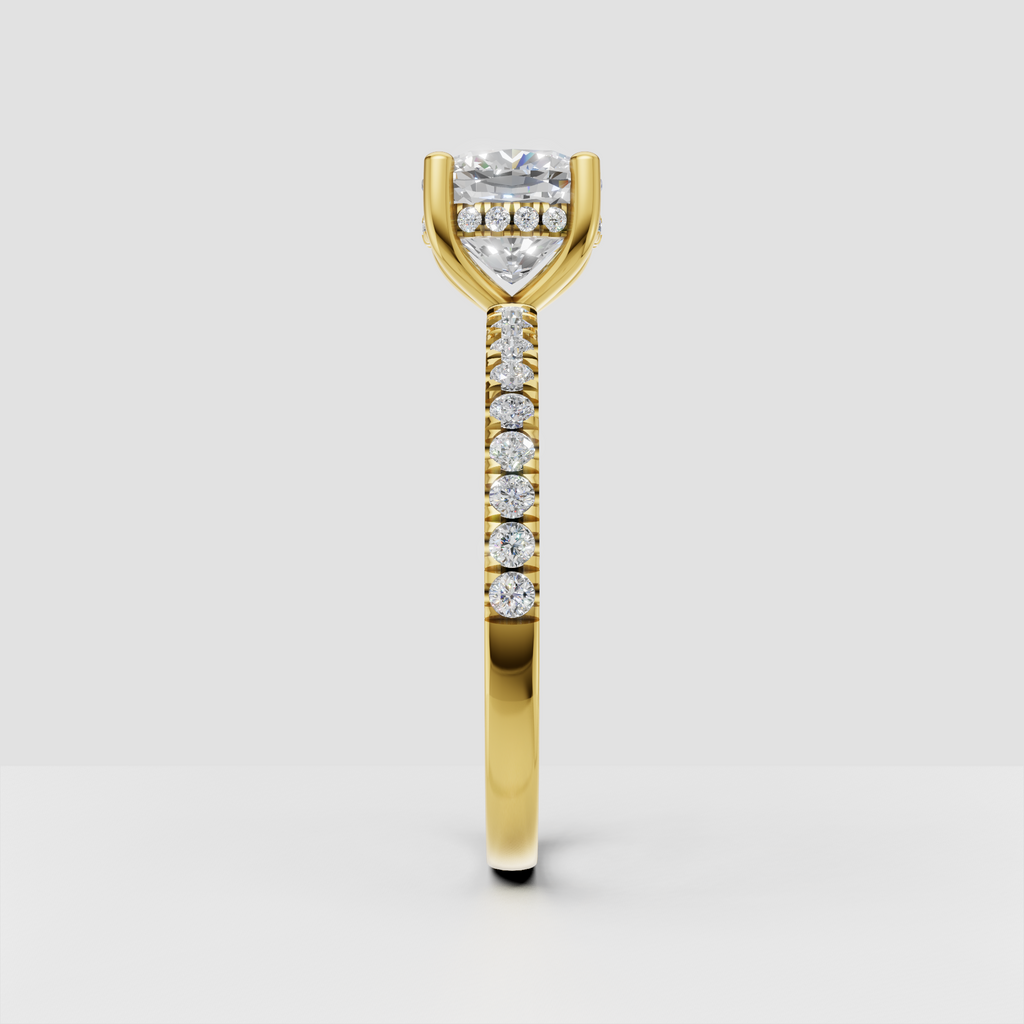 Yellow gold cushion diamond ring with pavé band