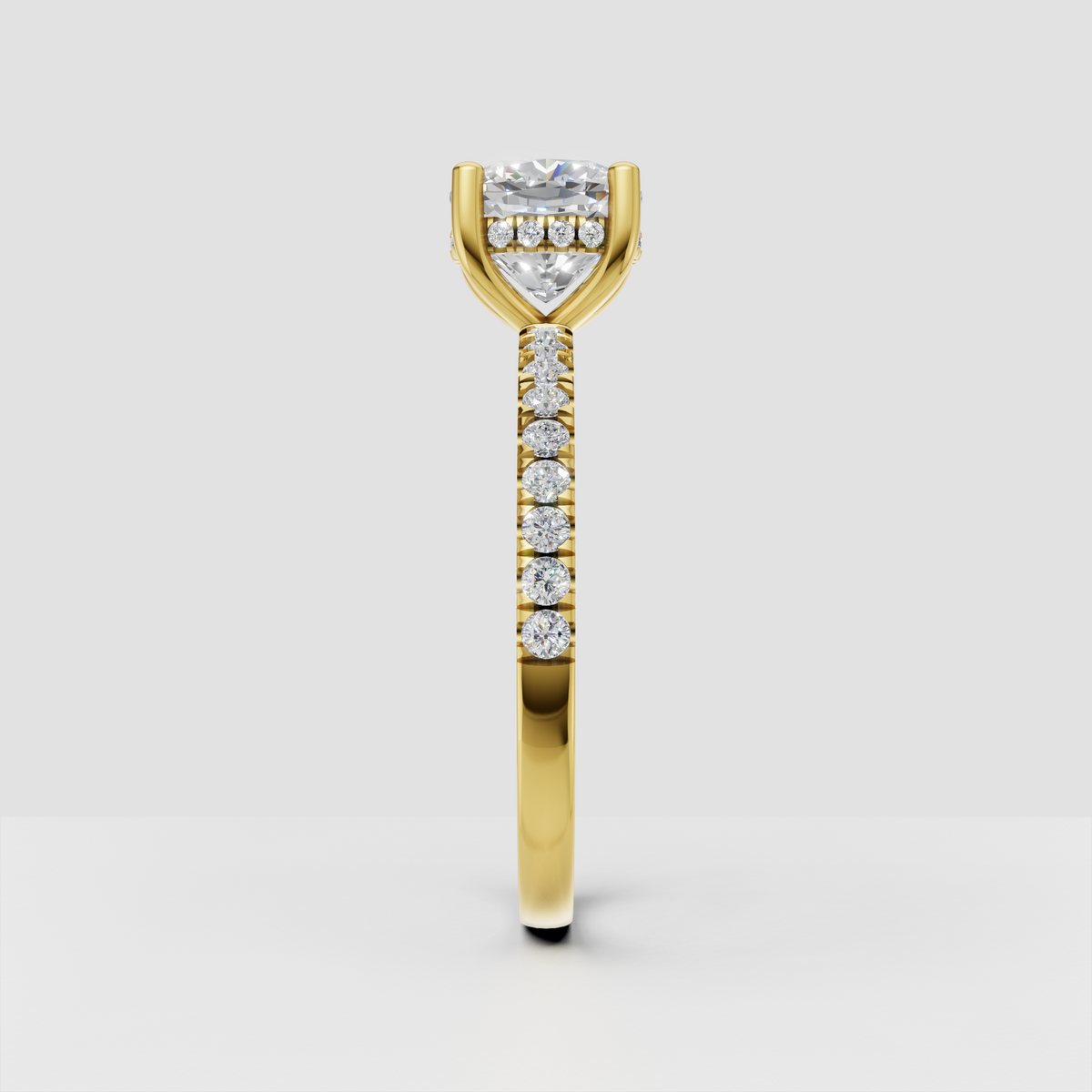 Yellow gold cushion diamond ring with pavé band