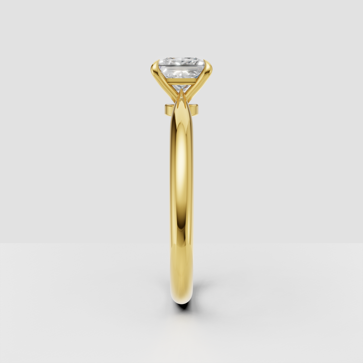 Yellow gold princess cut engagement ring with four-prong setting