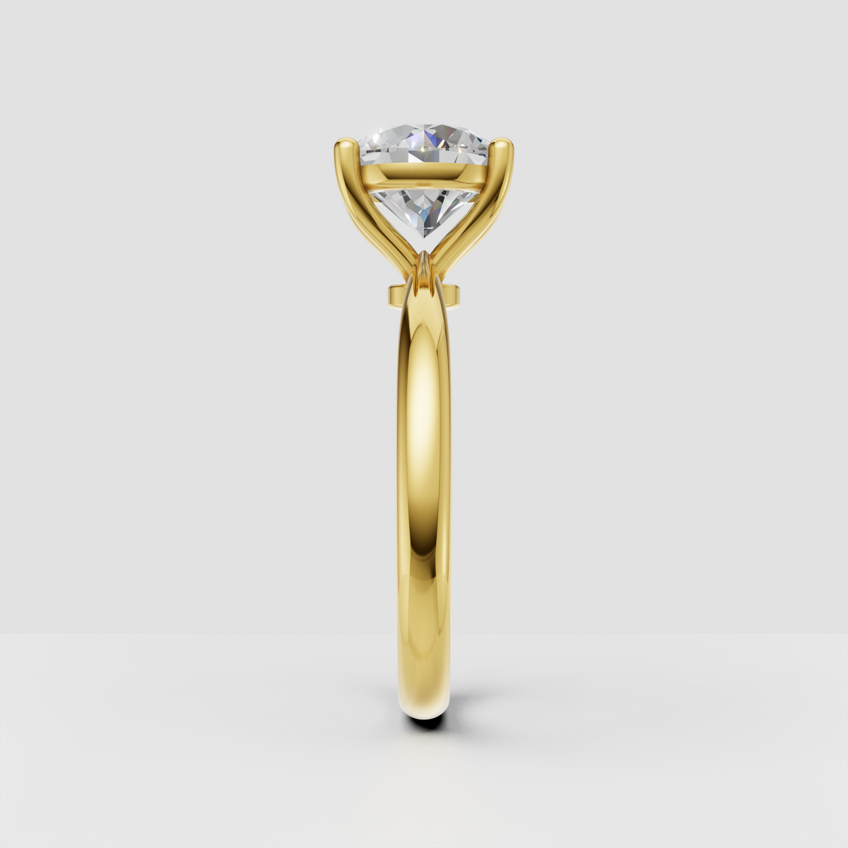 Round brilliant diamond ring featuring elegant four-prong gold setting
