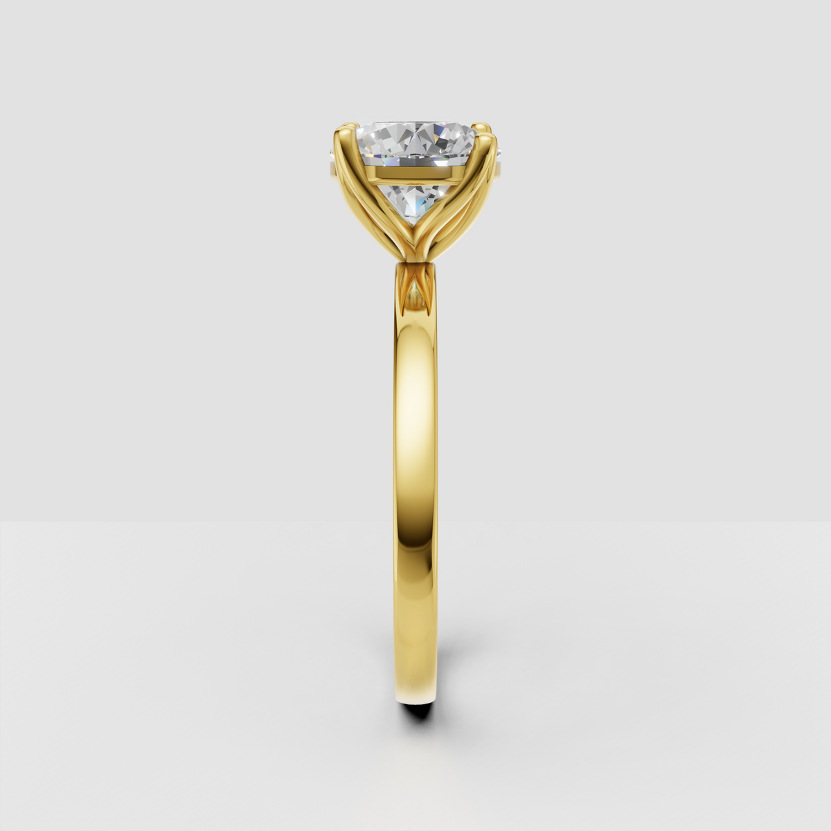 Yellow gold round solitaire engagement ring with cathedral setting