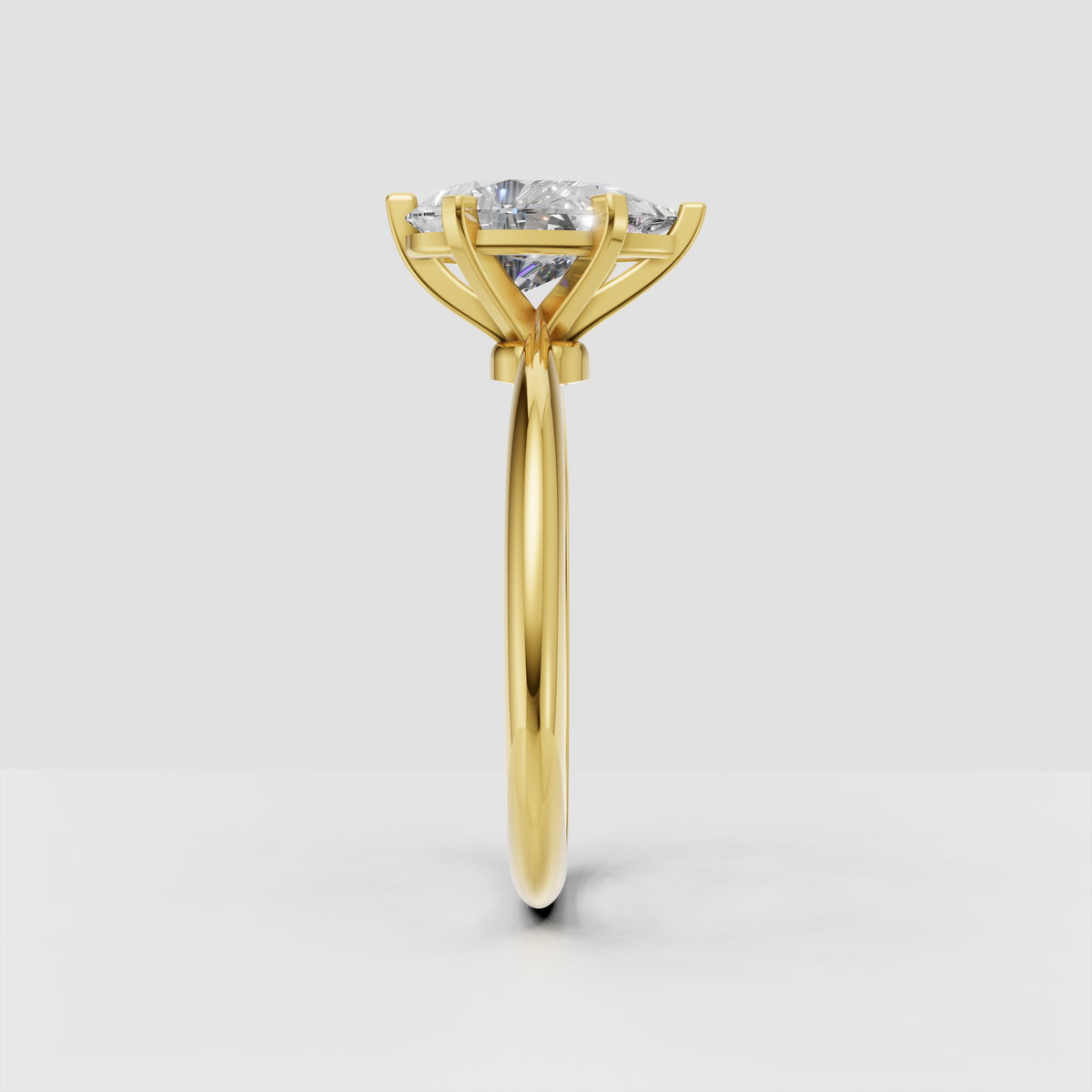 Elegant pear diamond ring featuring a smooth rounded rose gold band