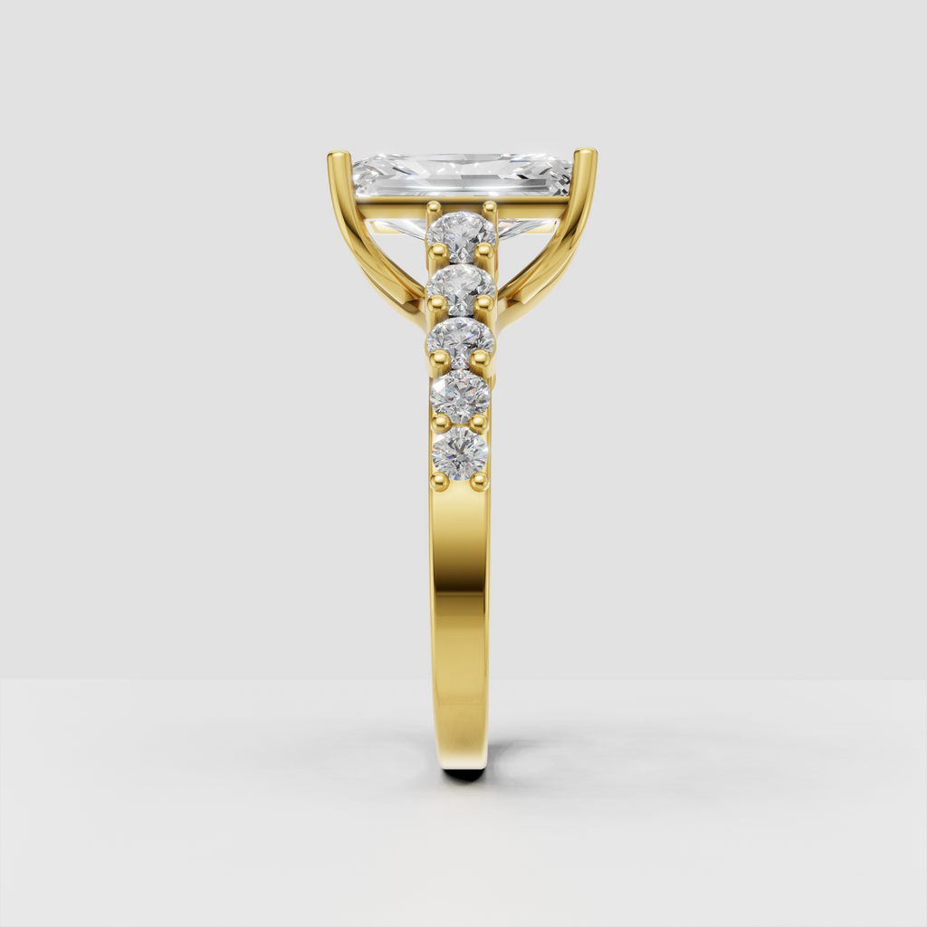 Yellow gold radiant diamond engagement ring with crossover shoulders
