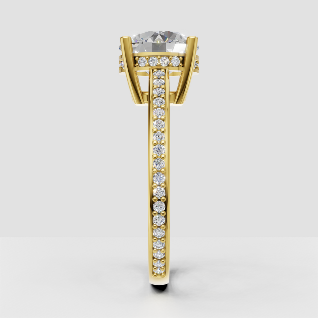 Round diamond solitaire ring with four rounded prongs and sparkling side stones.