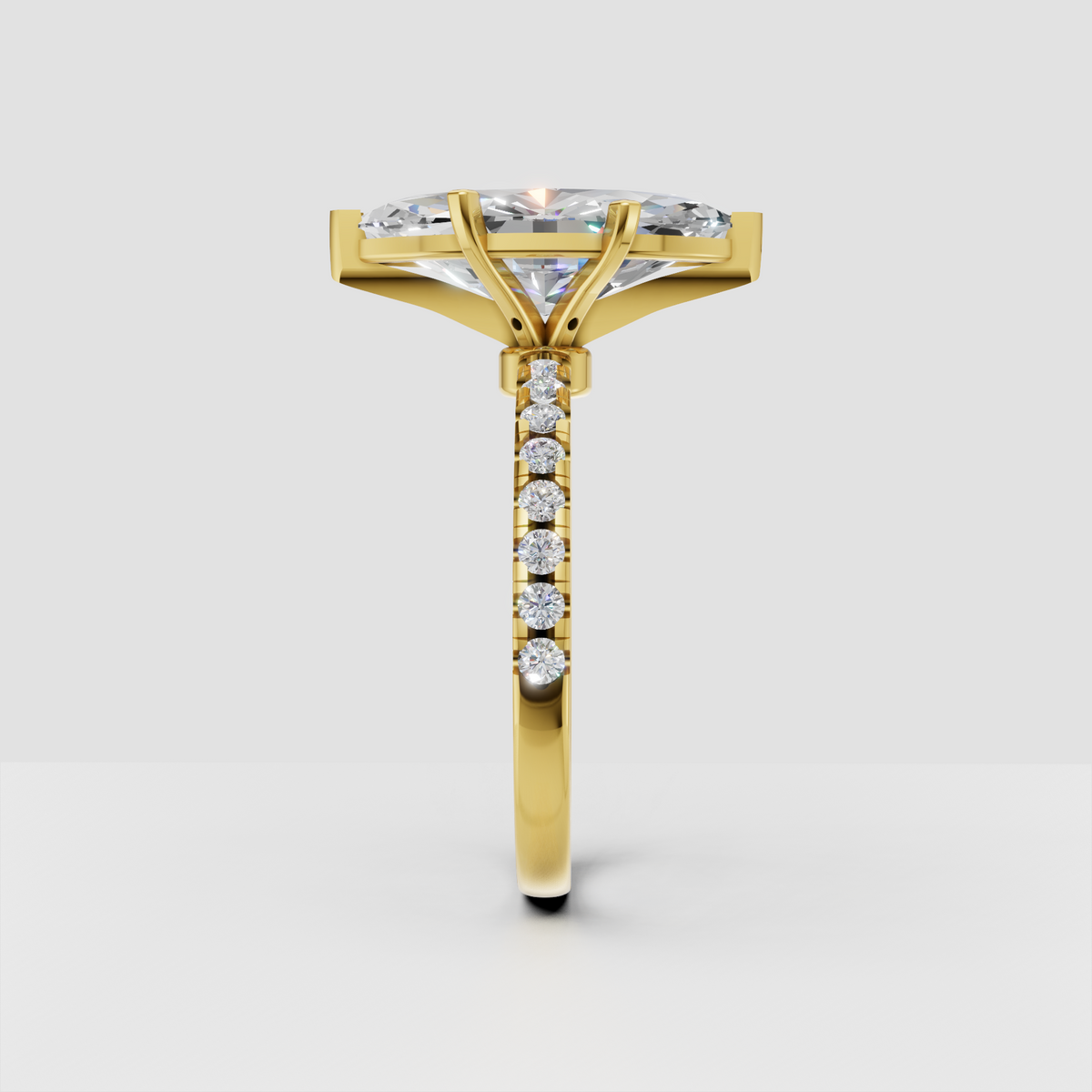 Yellow gold marquise diamond ring with pave band