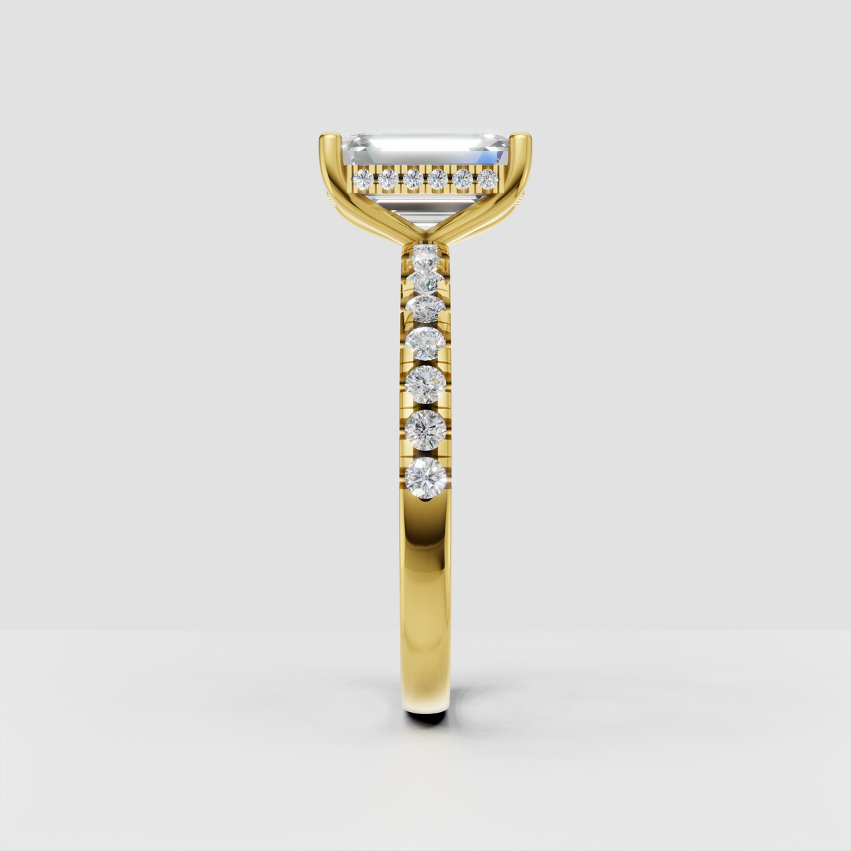 Yellow gold emerald diamond ring with four-prong setting