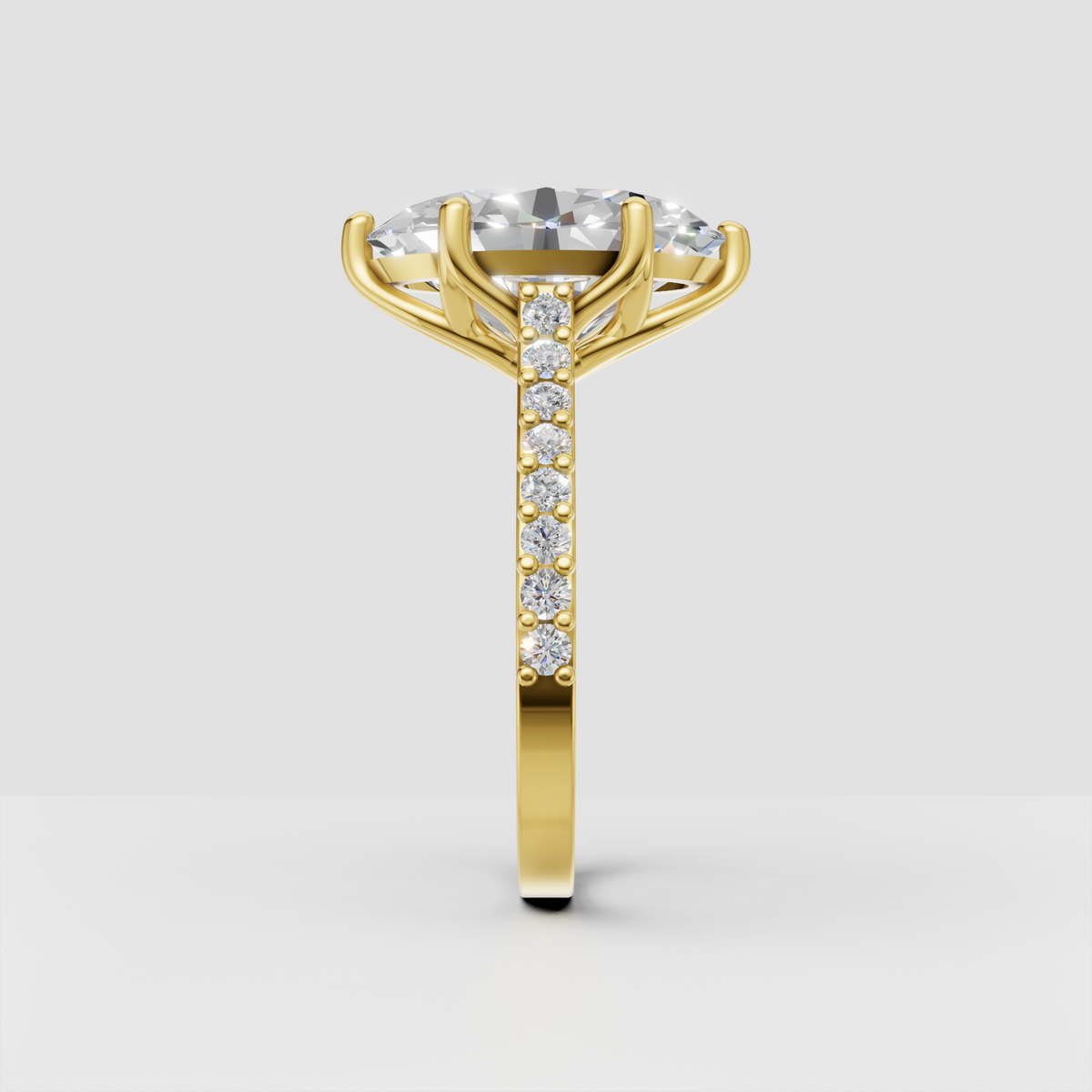 Yellow gold oval engagement ring with pavé-set shoulders
