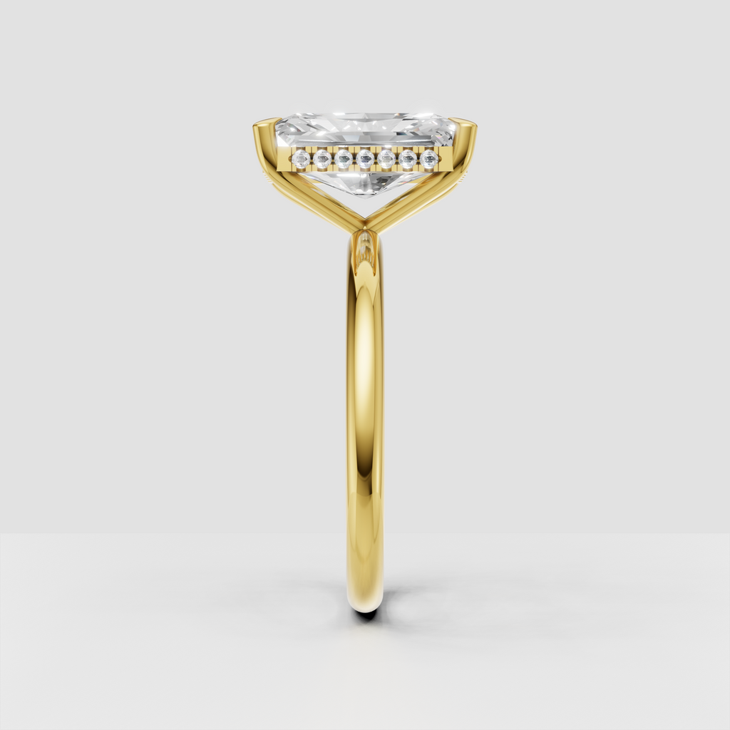 Elongated radiant diamond engagement ring with hidden halo
