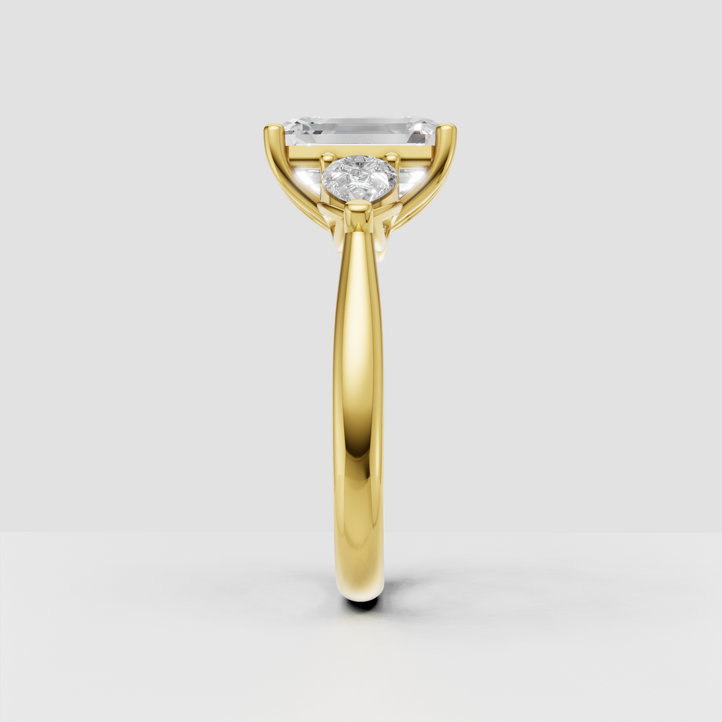 Emerald cut diamond ring with pear side stones