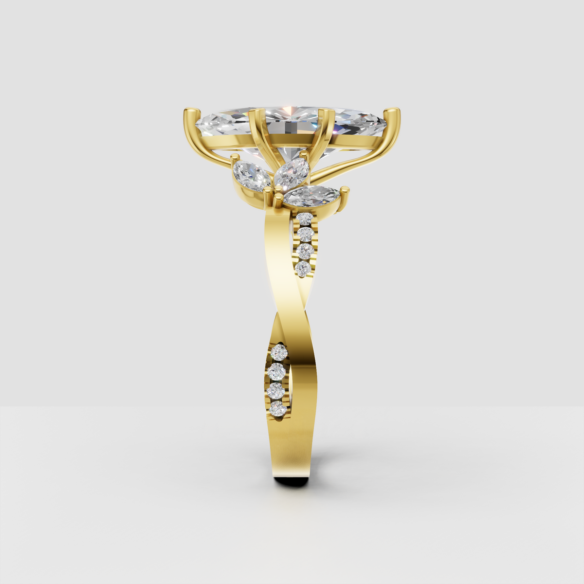 Yellow gold marquise diamond ring with pavé shoulders
