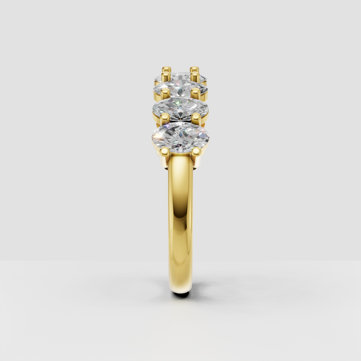 Full eternity band with oval-cut diamonds in a polished gold setting