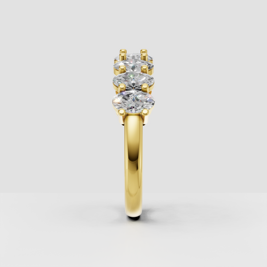 Full eternity band with oval-cut diamonds in a polished gold setting