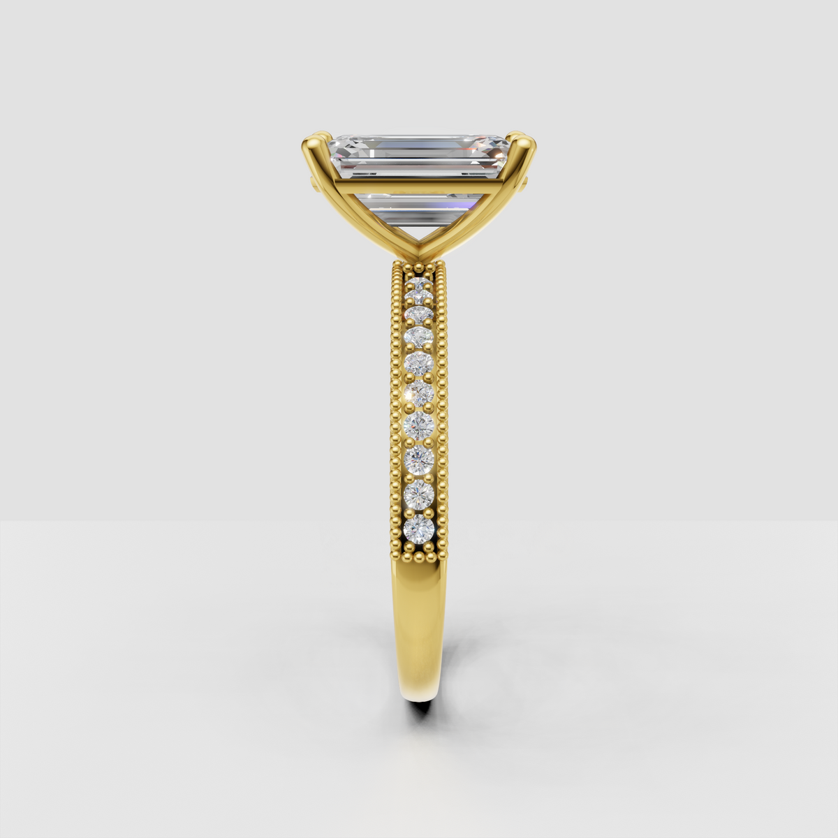 Yellow gold emerald cut Diamond ring with vintage milgrain detailing