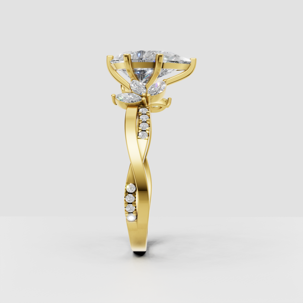 Pear cut diamond engagement ring with split shank and diamond accents