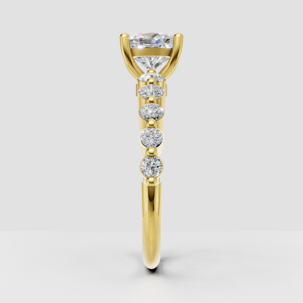 Yellow gold cushion diamond ring with four claw prong center setting