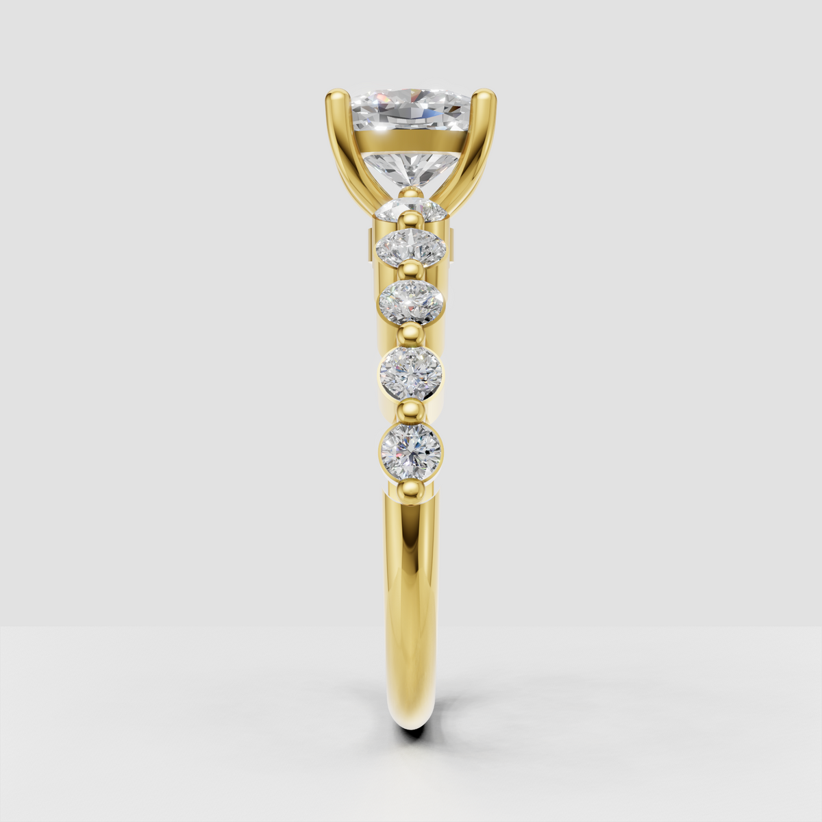 Yellow gold cushion diamond ring with four claw prong center setting