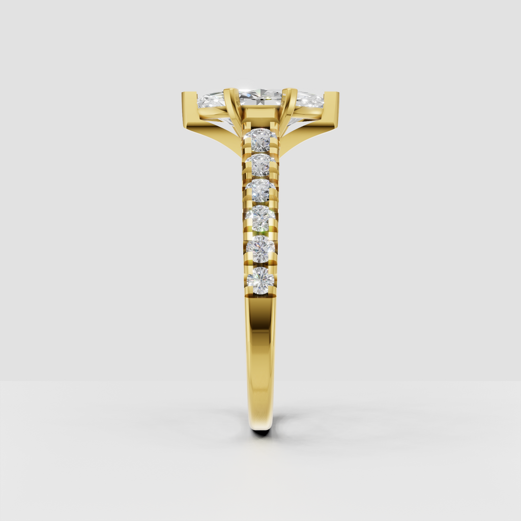 Yellow gold marquise diamond ring with six-prong setting and round side stones