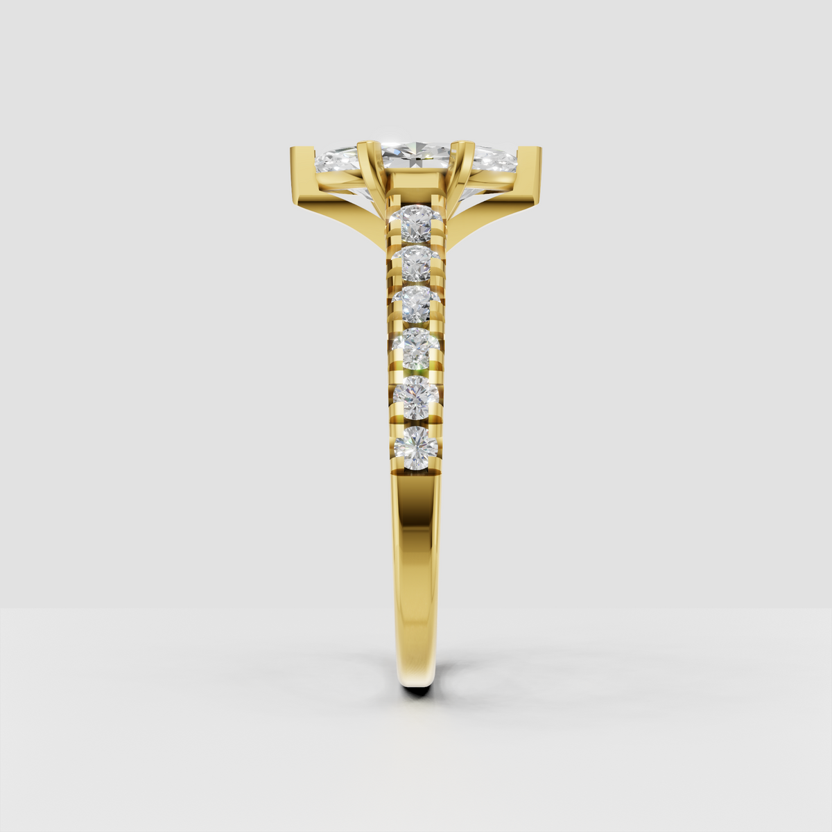 Yellow gold marquise diamond ring with six-prong setting and round side stones