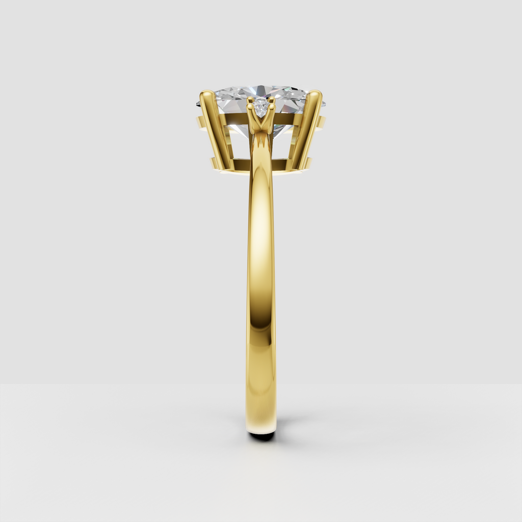 Yellow gold oval diamond ring with six-prong center setting
