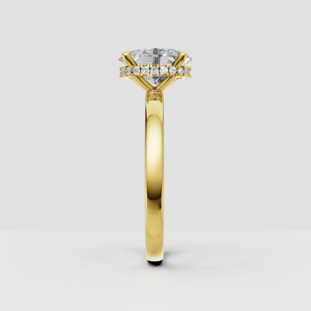 Oval cut diamond ring featuring a hidden halo of round accent stones