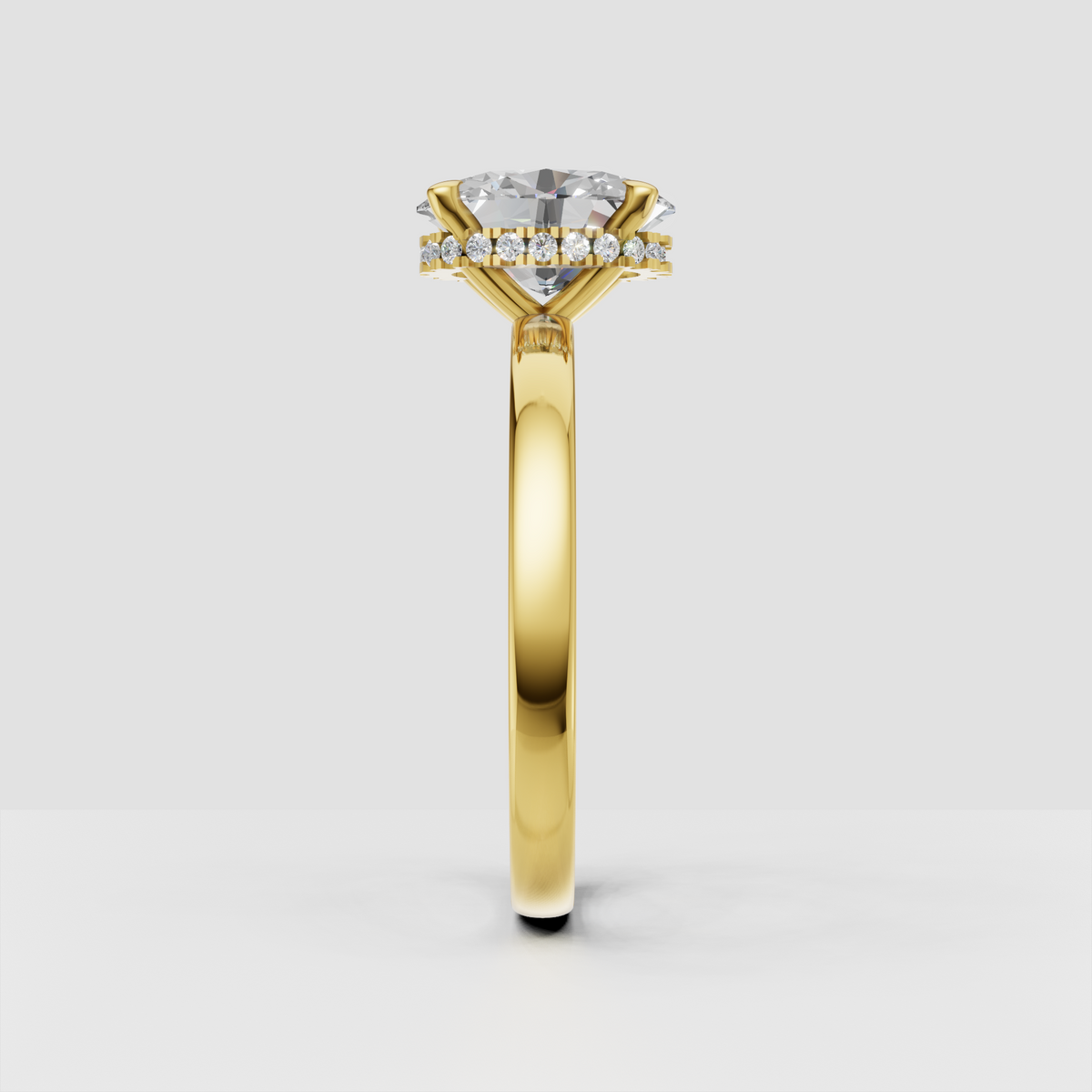 Oval cut diamond ring featuring a hidden halo of round accent stones