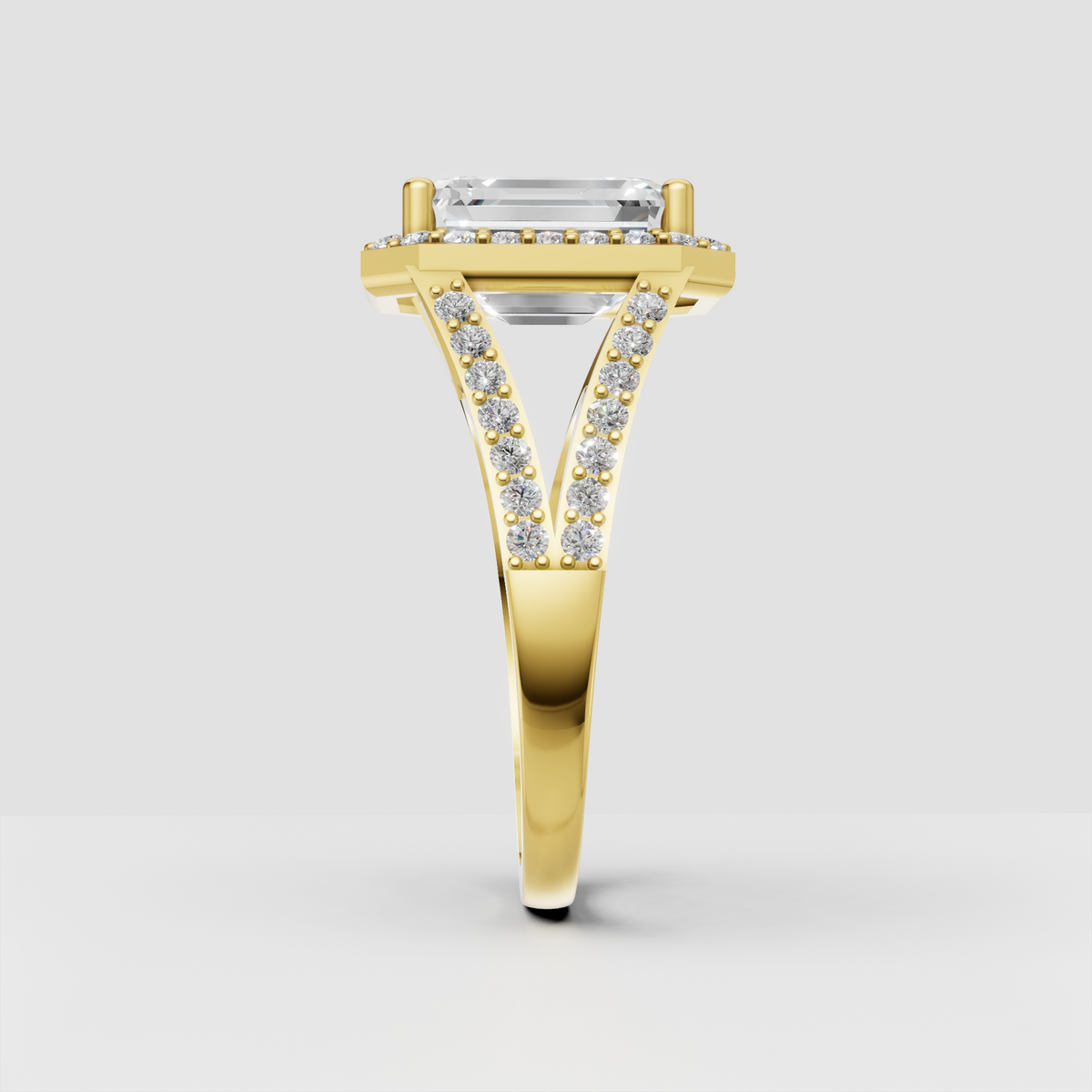 Emerald diamond ring featuring a full pavé halo and shoulders