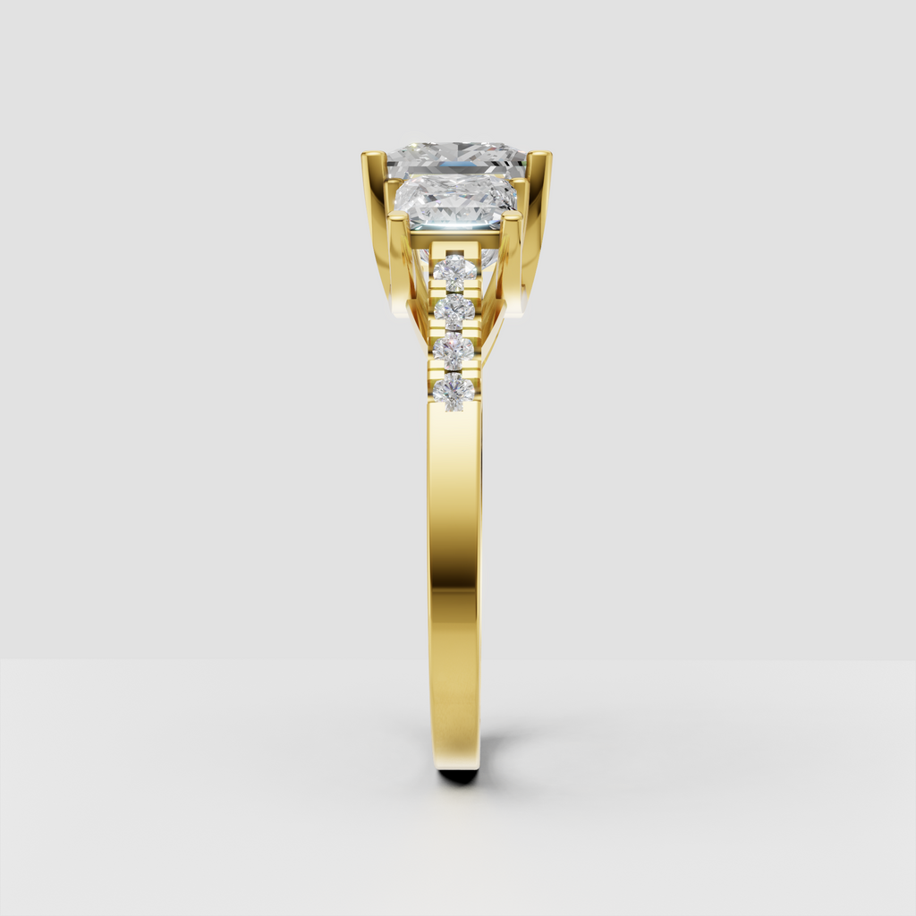 Three stone princess diamond ring with pavé yellow gold band
