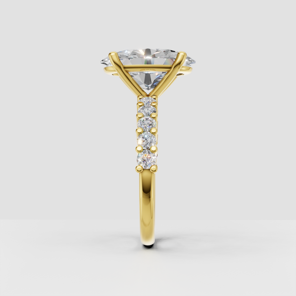 Yellow gold oval diamond ring with four-prong center setting