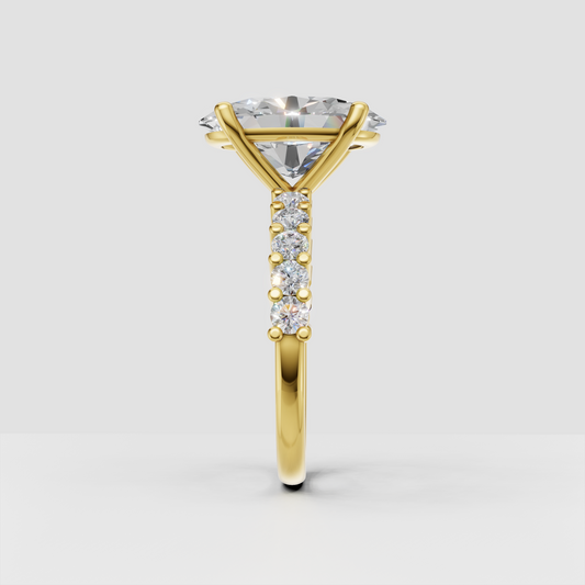 Yellow gold oval diamond ring with four-prong center setting