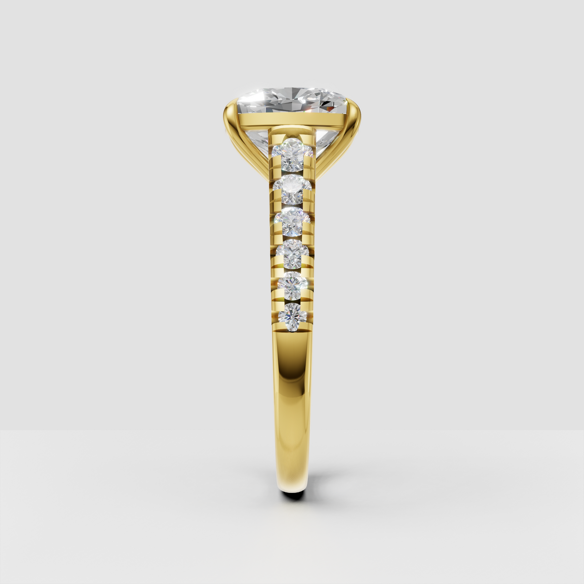 Yellow gold cushion diamond engagement ring with side stones
