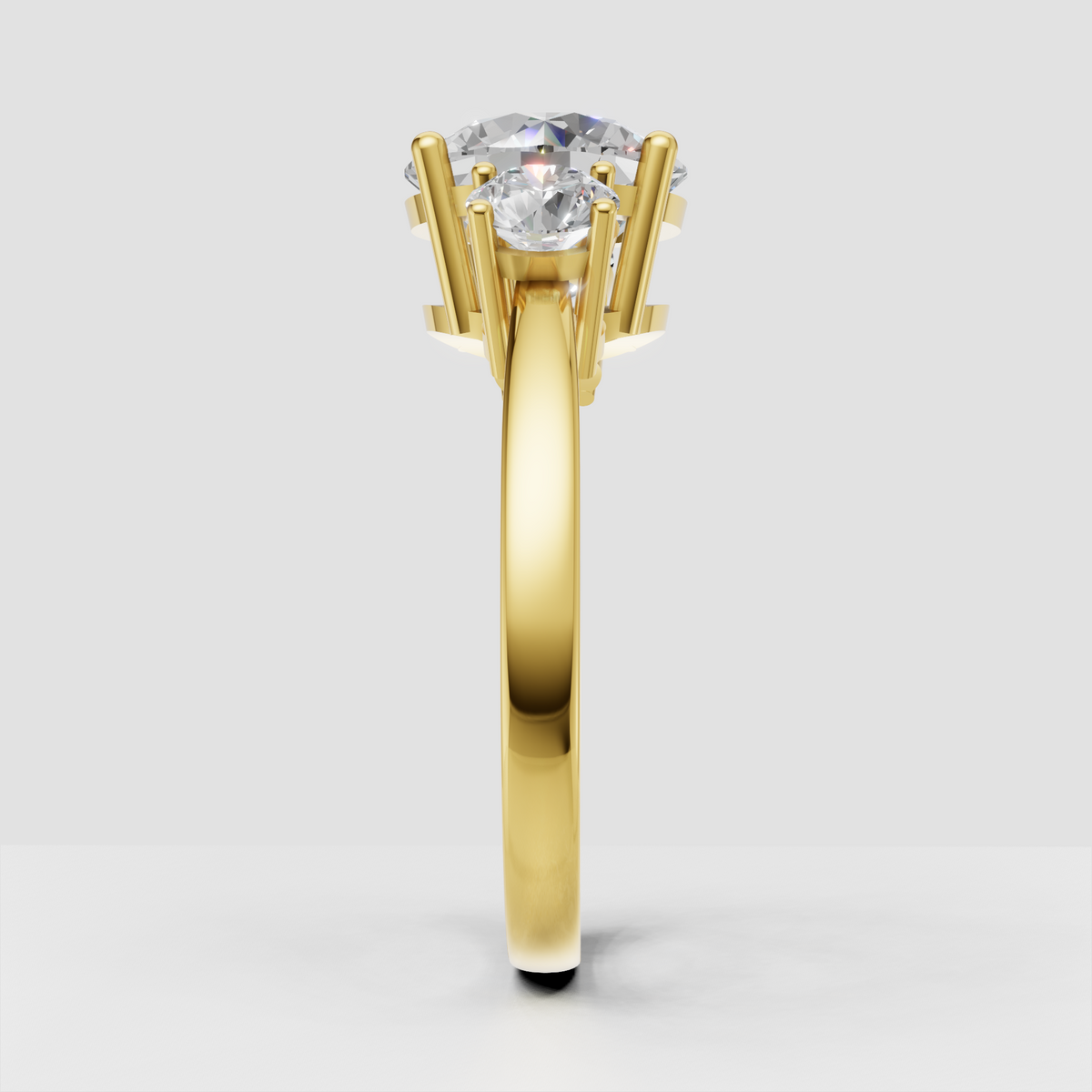 Round cut three stone diamond ring with gold band