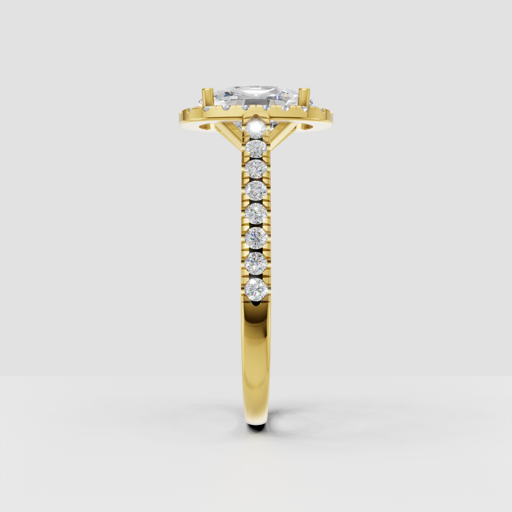 Yellow gold elongated cushion cut diamond halo ring with diamond accented shoulders